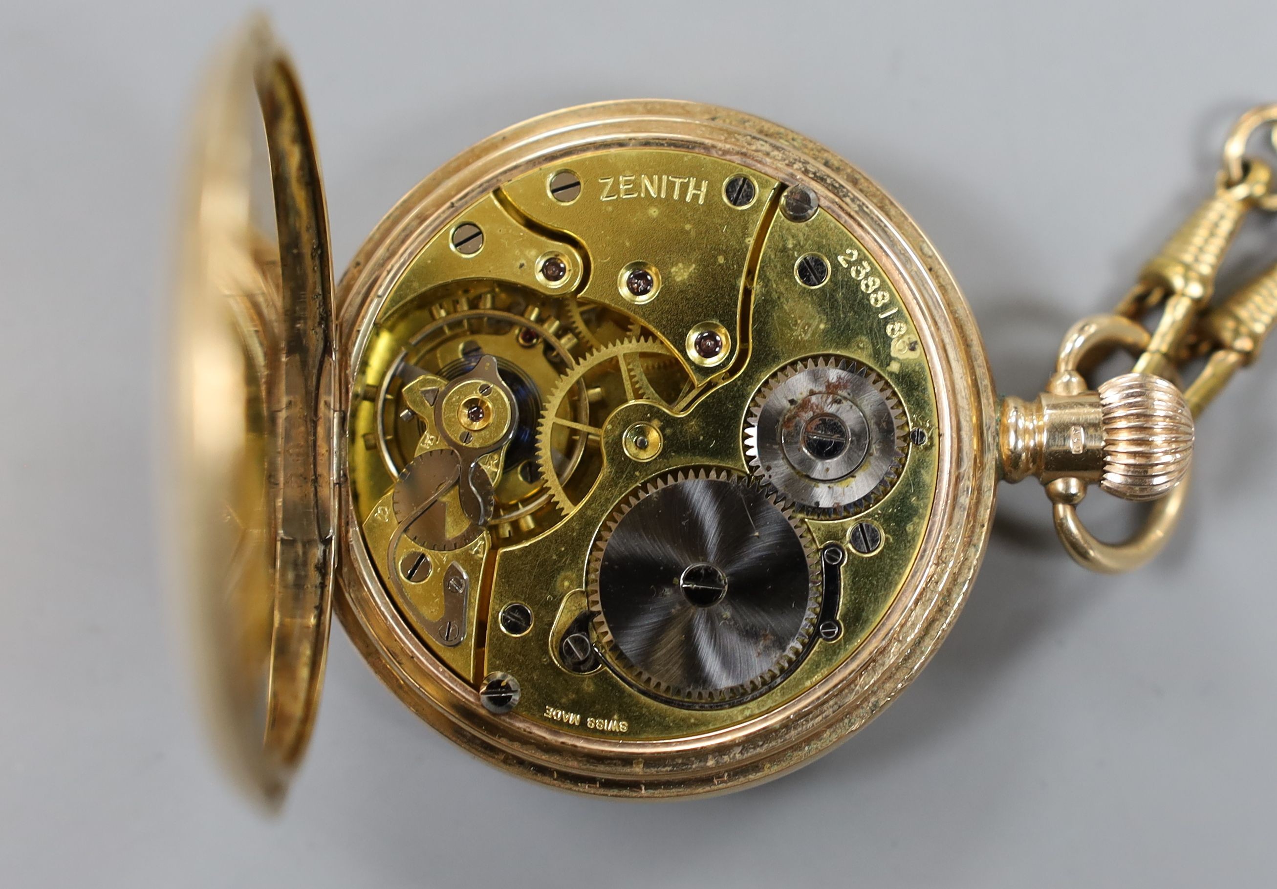 A George V 9ct gold half hunter keyless Zenith pocket watch, case diameter 50mm, gross 99 grams, with a gilt metal albert.